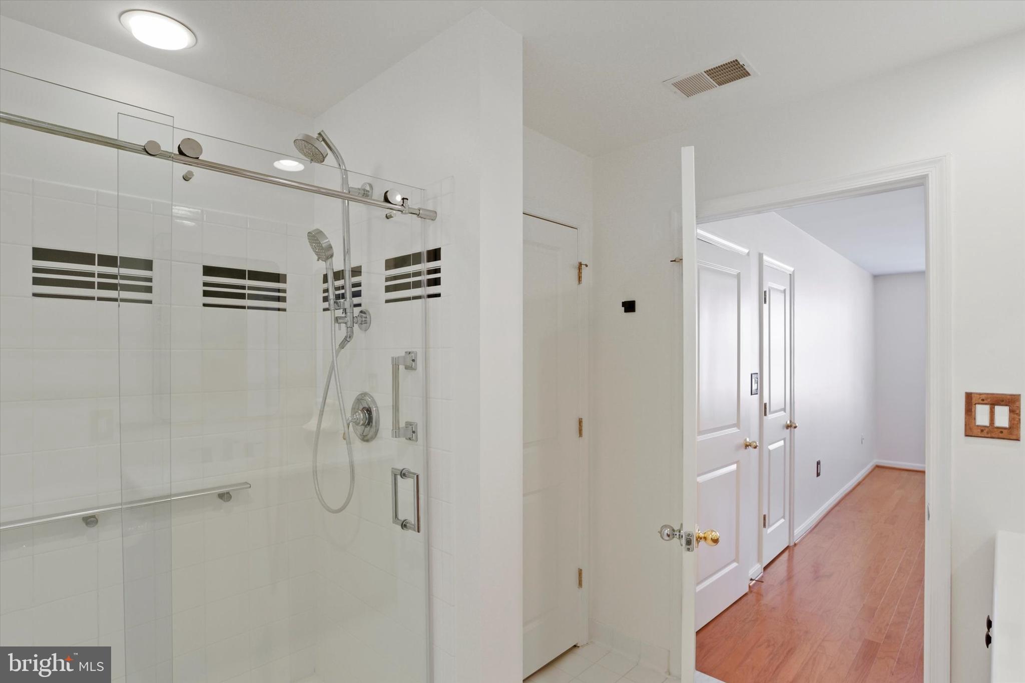 9500 Sidebrook Road, Unit 207 Owings Mills, MD 21117 - Photo 21 of 26 Updated walk-in shower with custom shower faucet.