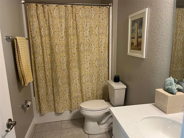 a bathroom with a toilet and a sink