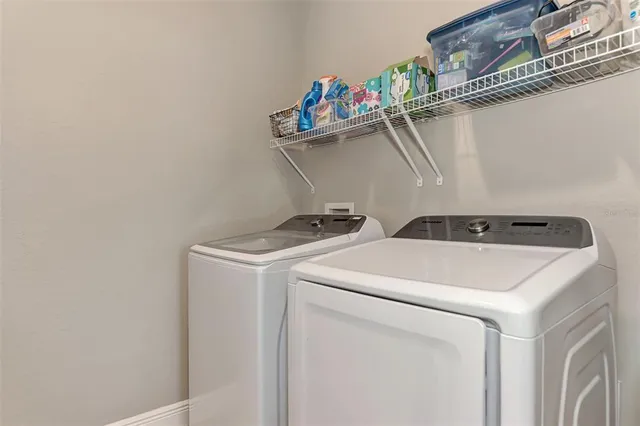 a utility room with dryer and washer