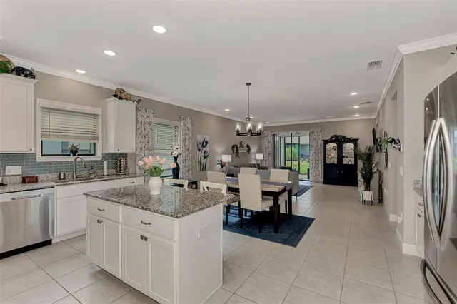 a large kitchen with a lot of counter space and a sink