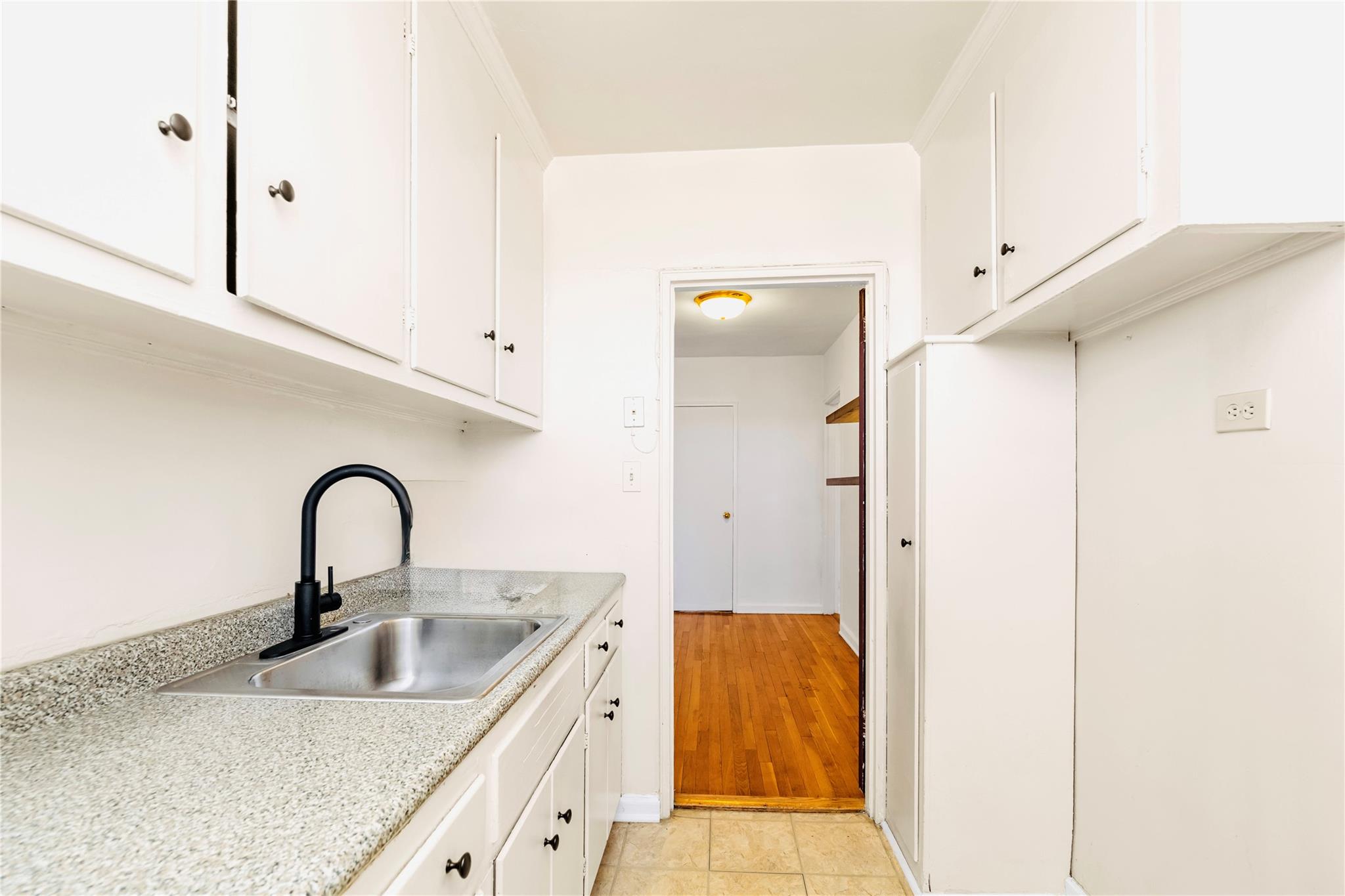 141-05 Pershing Crescent, Unit 511 Queens, NY 11435 - Photo 11 of 14 a close view of a sink and tap