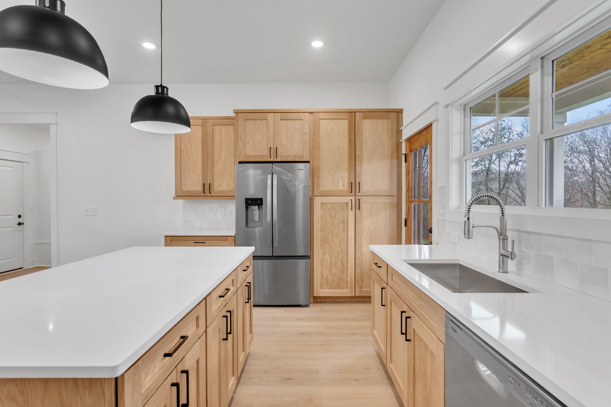 1111 Abiff Road Bon Aqua, TN 37025 - Photo 15 of 34 a kitchen with a sink and a refrigerator