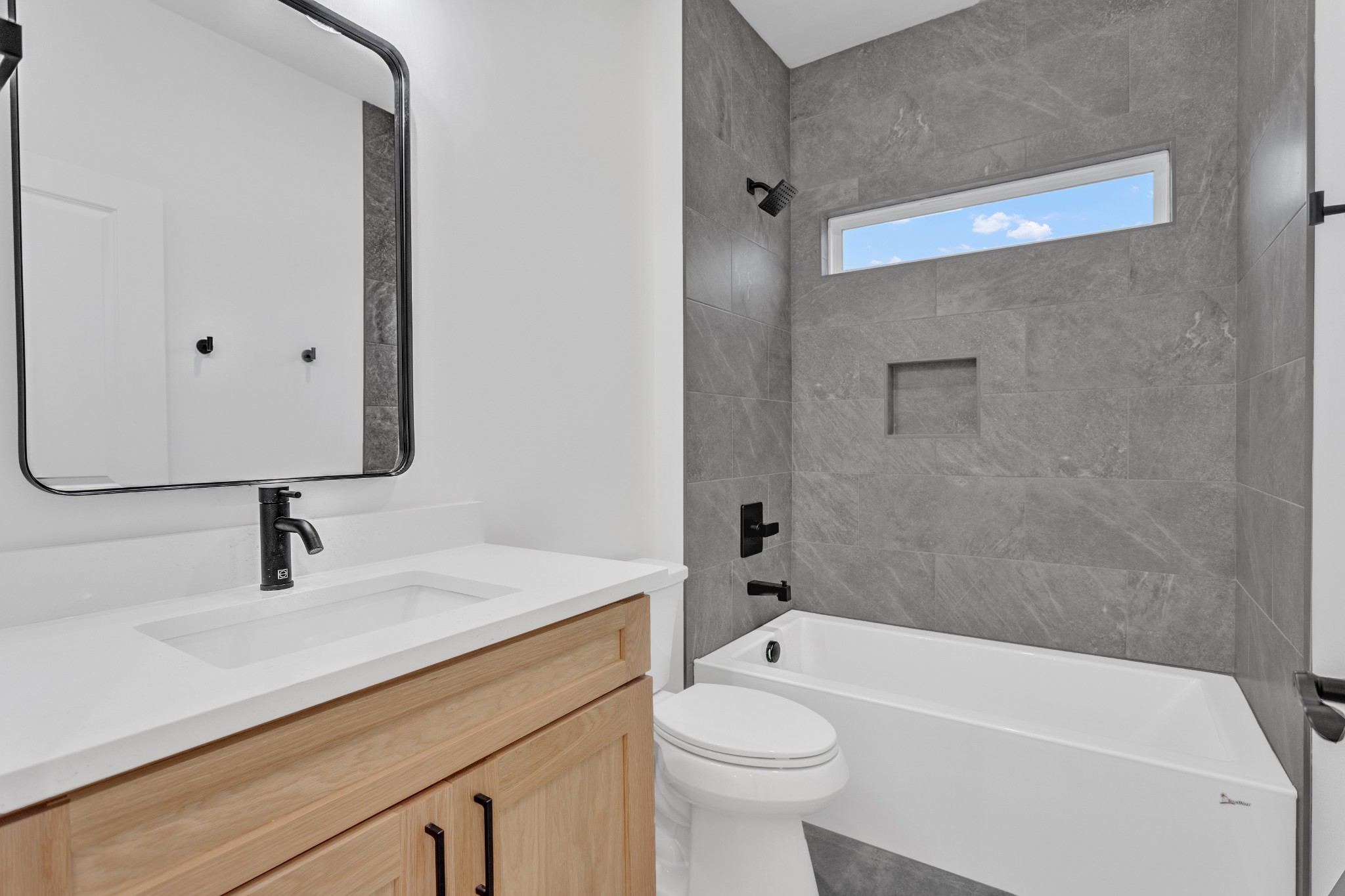 1111 Abiff Road Bon Aqua, TN 37025 - Photo 26 of 34 a bathroom with a sink a toilet and bathtub