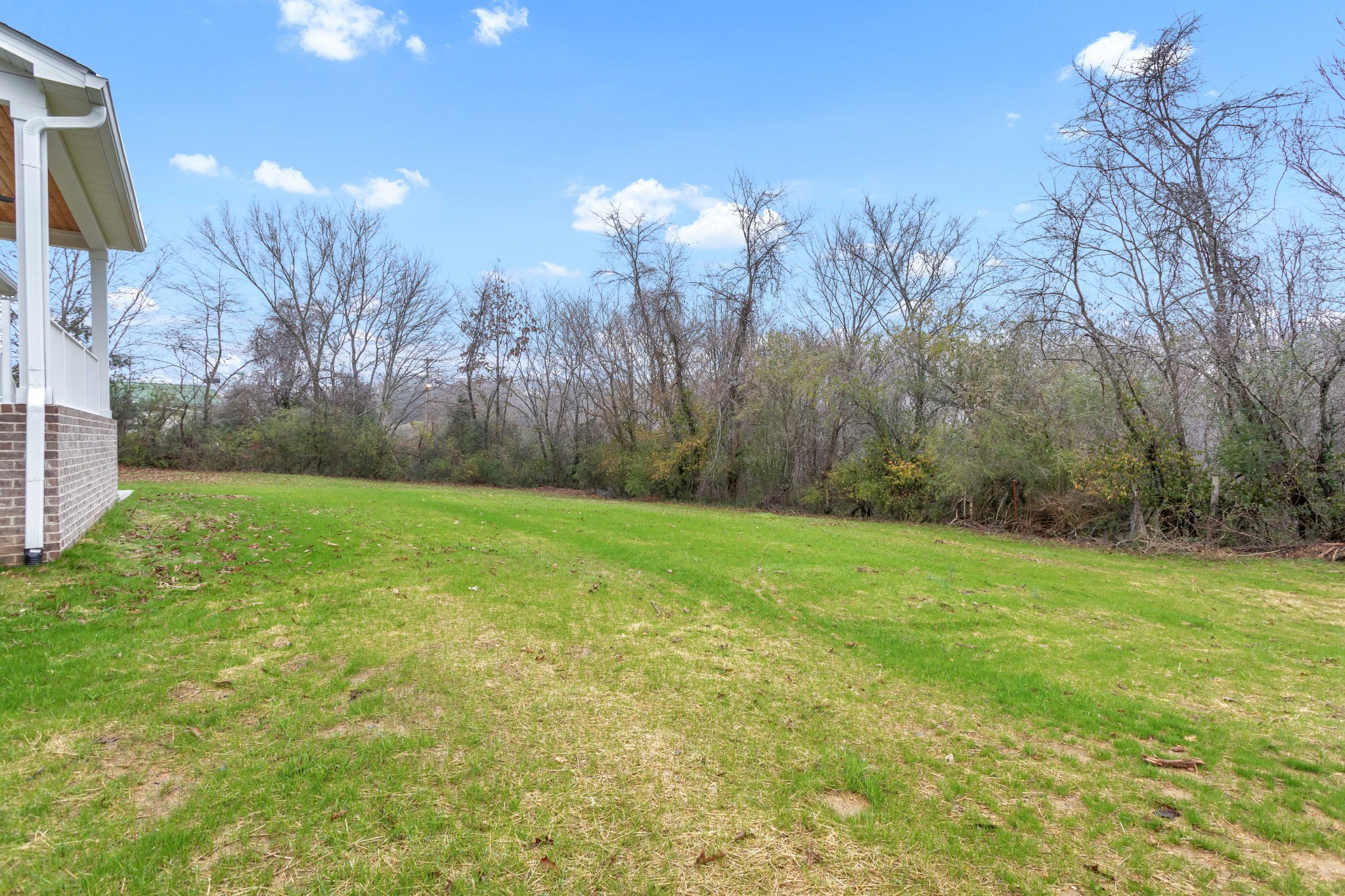 1111 Abiff Road Bon Aqua, TN 37025 - Photo 32 of 34 a view of a yard with a house in the background