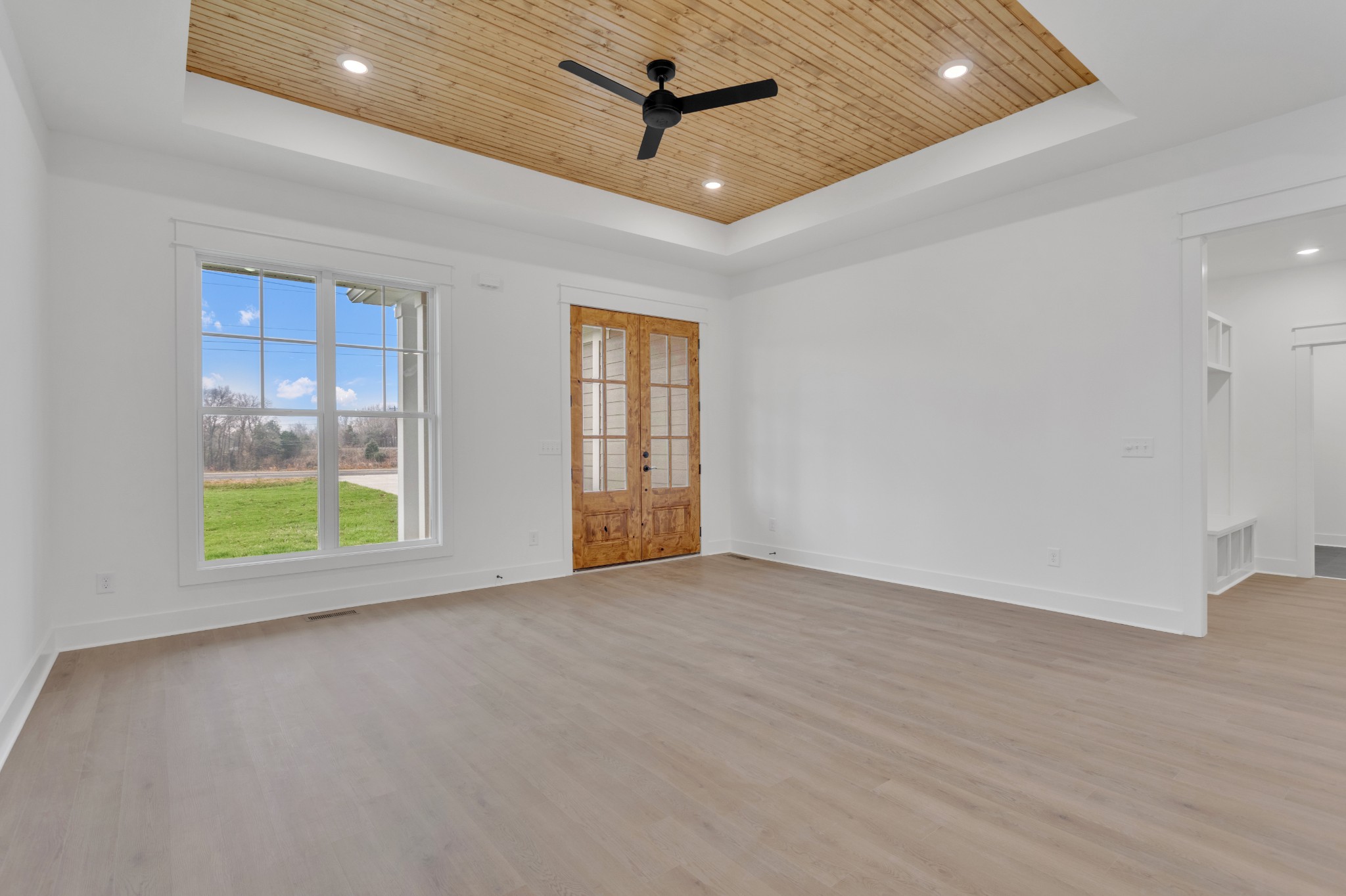 1111 Abiff Road Bon Aqua, TN 37025 - Photo 7 of 34 an empty room with windows and ceiling fan