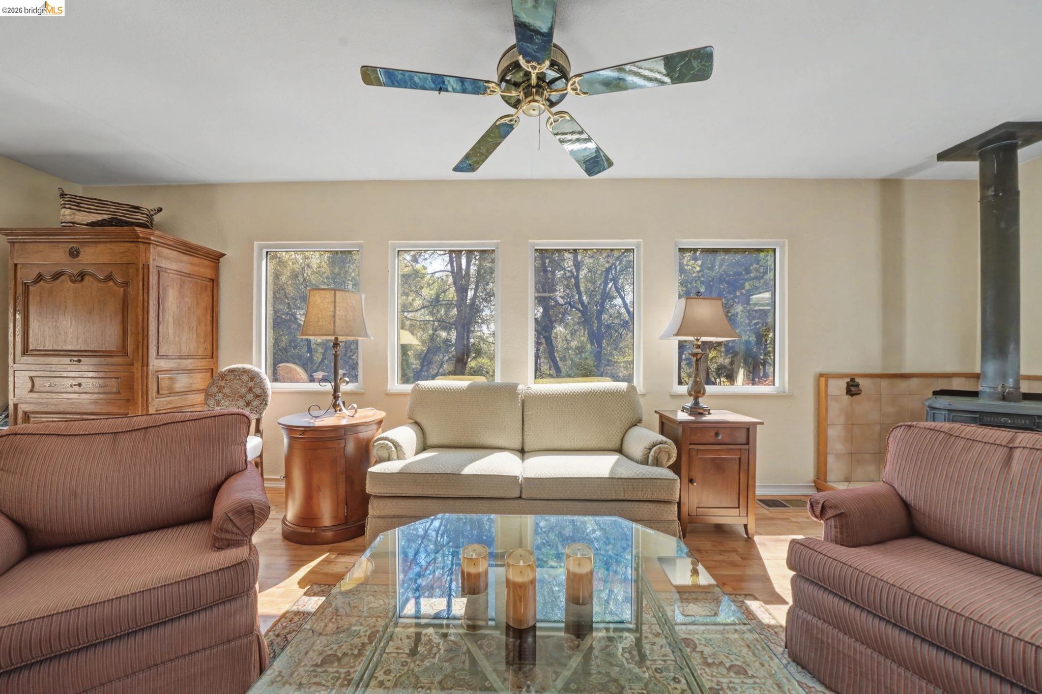 7035 Old Gulch Road San Andreas, CA 95249 - Photo 15 of 45 Living area featuring light wood-style flooring and a ceiling fan
