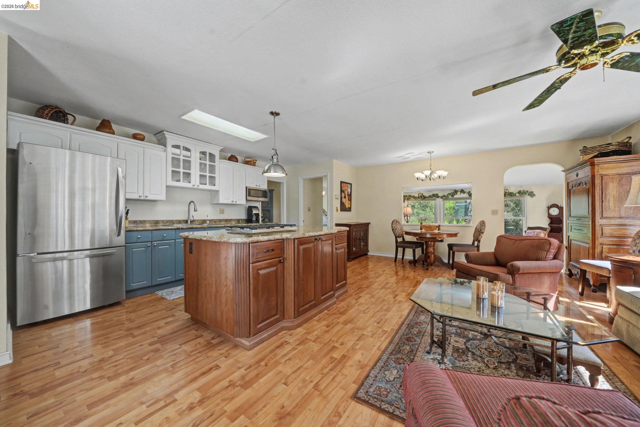 7035 Old Gulch Road San Andreas, CA 95249 - Photo 44 of 45 Kitchen with stainless steel appliances, dual tone cabinets, light wood finished floors, arched walkways, and open floor plan