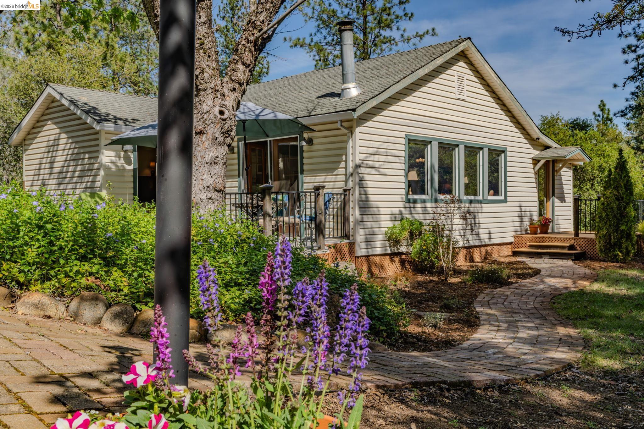 7035 Old Gulch Road San Andreas, CA 95249 - Photo 2 of 45 View of front of house featuring a deck and a shingled roof