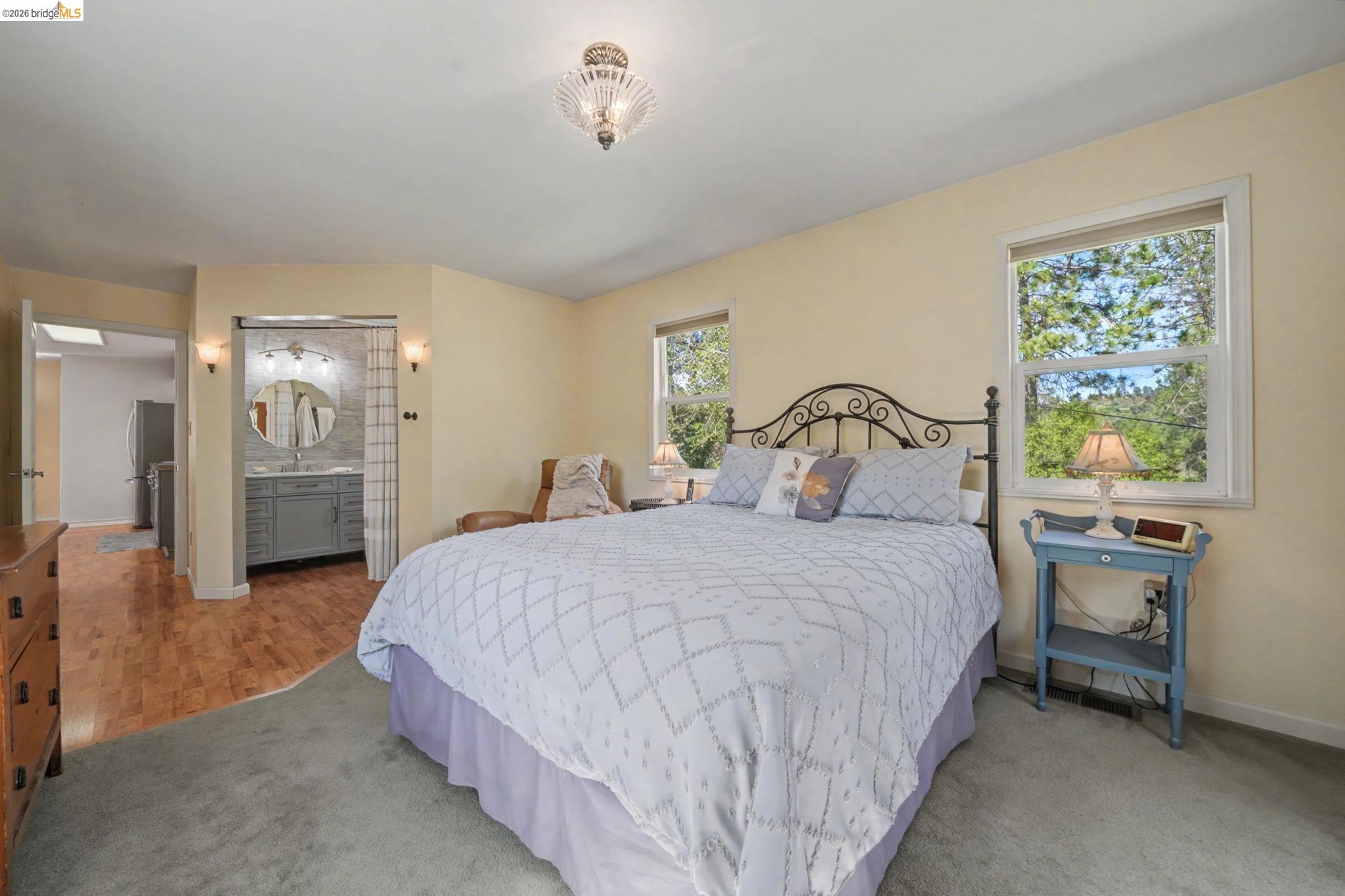 7035 Old Gulch Road San Andreas, CA 95249 - Photo 28 of 45 Carpeted bedroom featuring connected bathroom and freestanding refrigerator