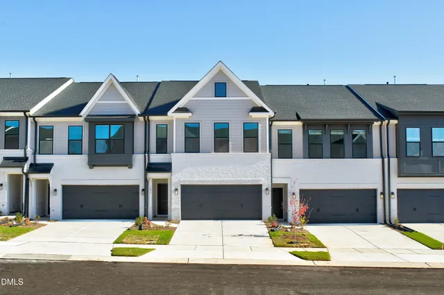 a view of house with yard