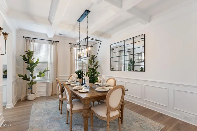 a view of a dining room with furniture and window