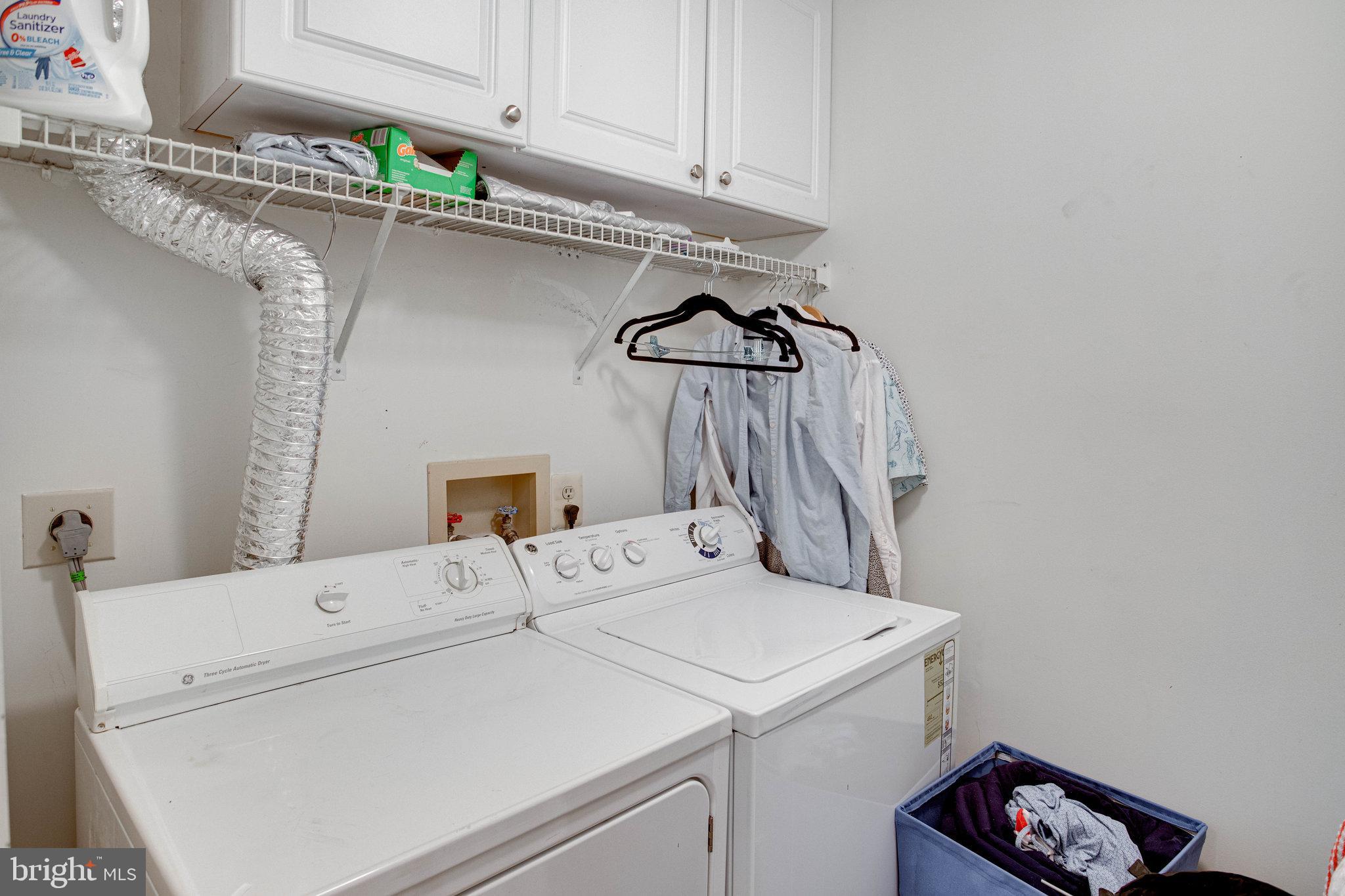 13615 Garfield Place, Unit 203 Woodbridge, VA 22191 - Photo 20 of 25 a utility room with dryer and washer