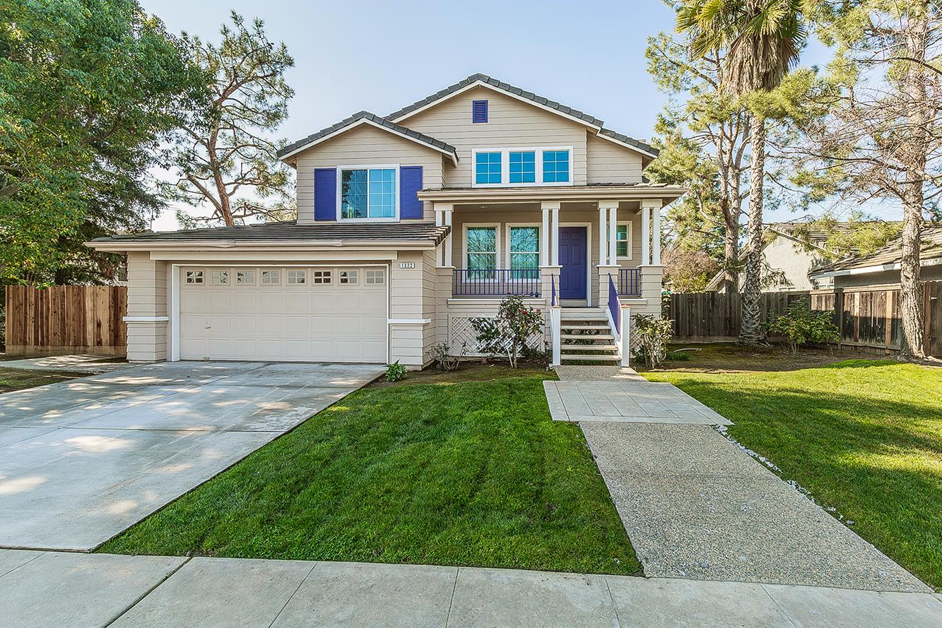 1322 Carson Avenue Clovis, CA 93611 - Photo 1 of 37 a front view of a house with a yard and garage