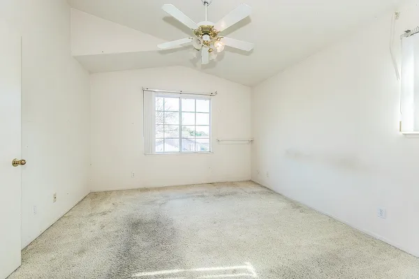 an empty room with a view of a bathroom