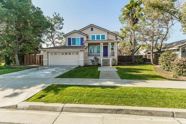 a front view of a house with a yard
