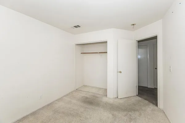 an empty room with mirror