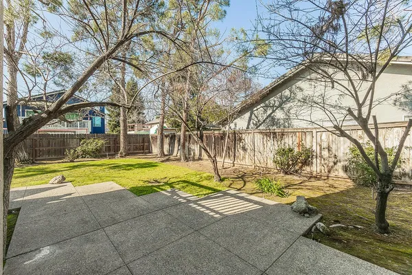 a view of a house with a large trees