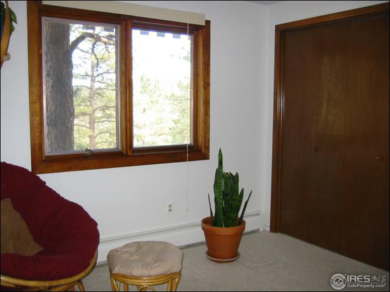 524 Kelly Road West Boulder, CO 80302 - Photo 13 of 18 a living room with furniture and a potted plant
