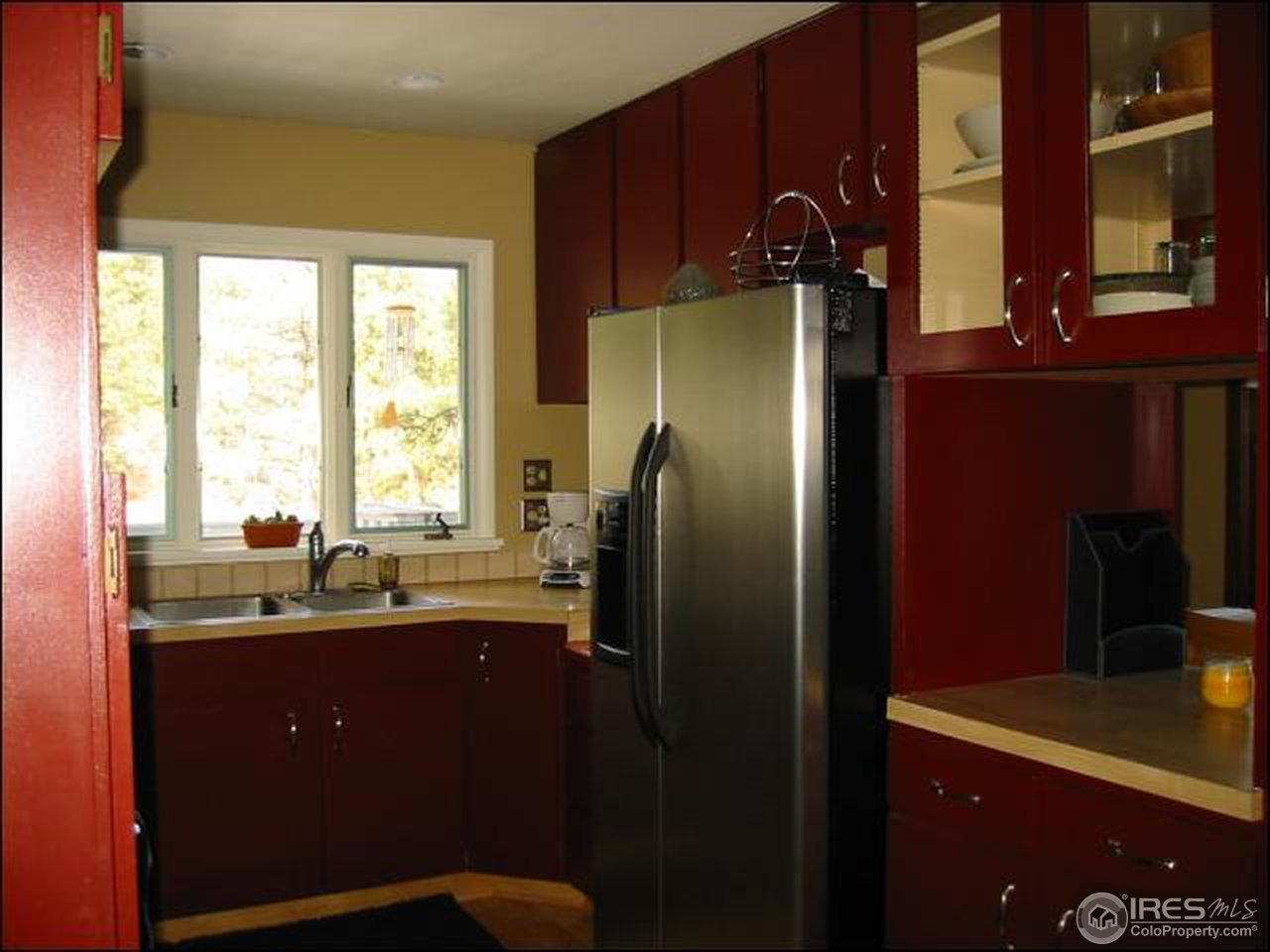 524 Kelly Road West Boulder, CO 80302 - Photo 7 of 18 a kitchen with a sink a refrigerator and window