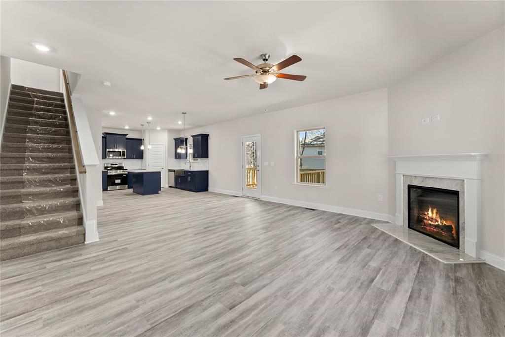 657 Forest Way Cornelia, GA 30531 - Photo 12 of 54 a view of a livingroom with a fireplace and window