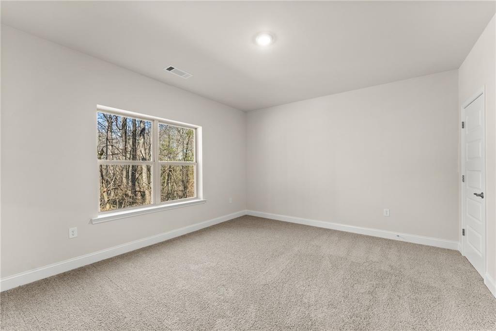 657 Forest Way Cornelia, GA 30531 - Photo 23 of 54 an empty room with a window