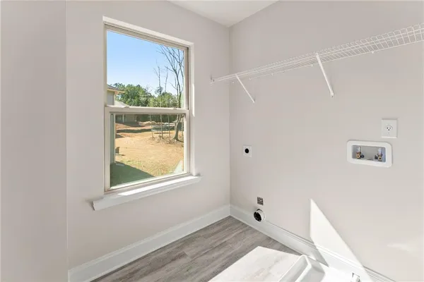 an empty room with closet area
