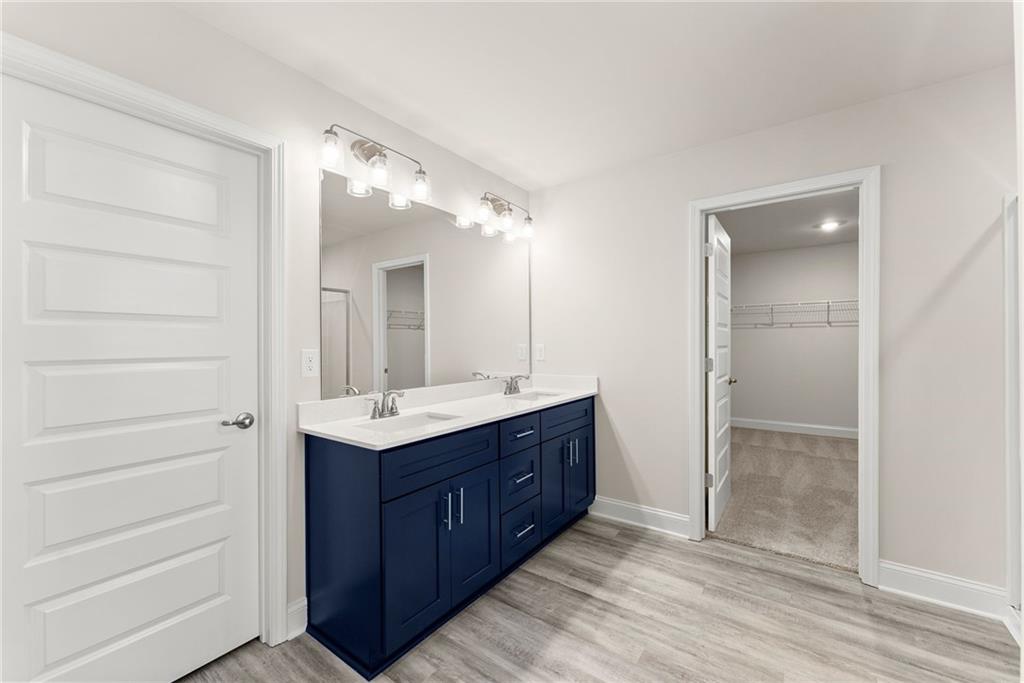 657 Forest Way Cornelia, GA 30531 - Photo 43 of 54 a bathroom with a sink and a mirror