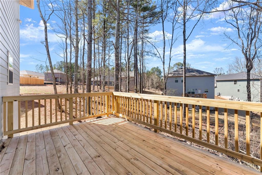 657 Forest Way Cornelia, GA 30531 - Photo 46 of 54 a view of balcony with wooden floor and fence