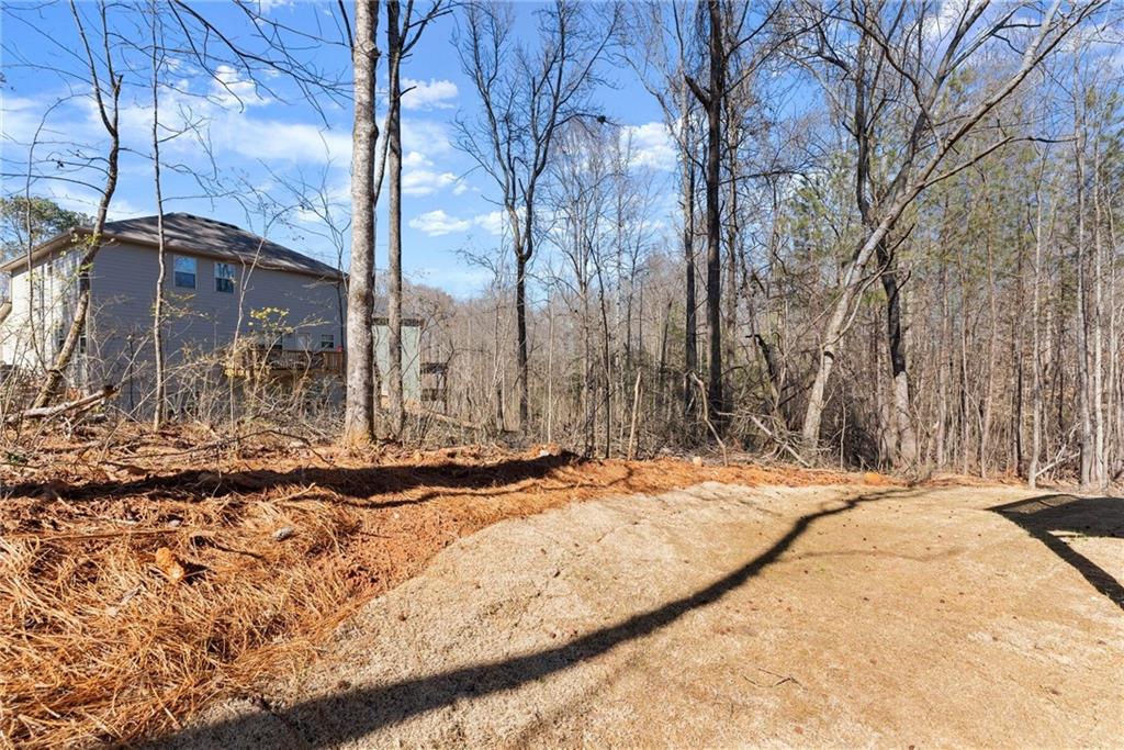 657 Forest Way Cornelia, GA 30531 - Photo 47 of 54 a backyard of house with large trees