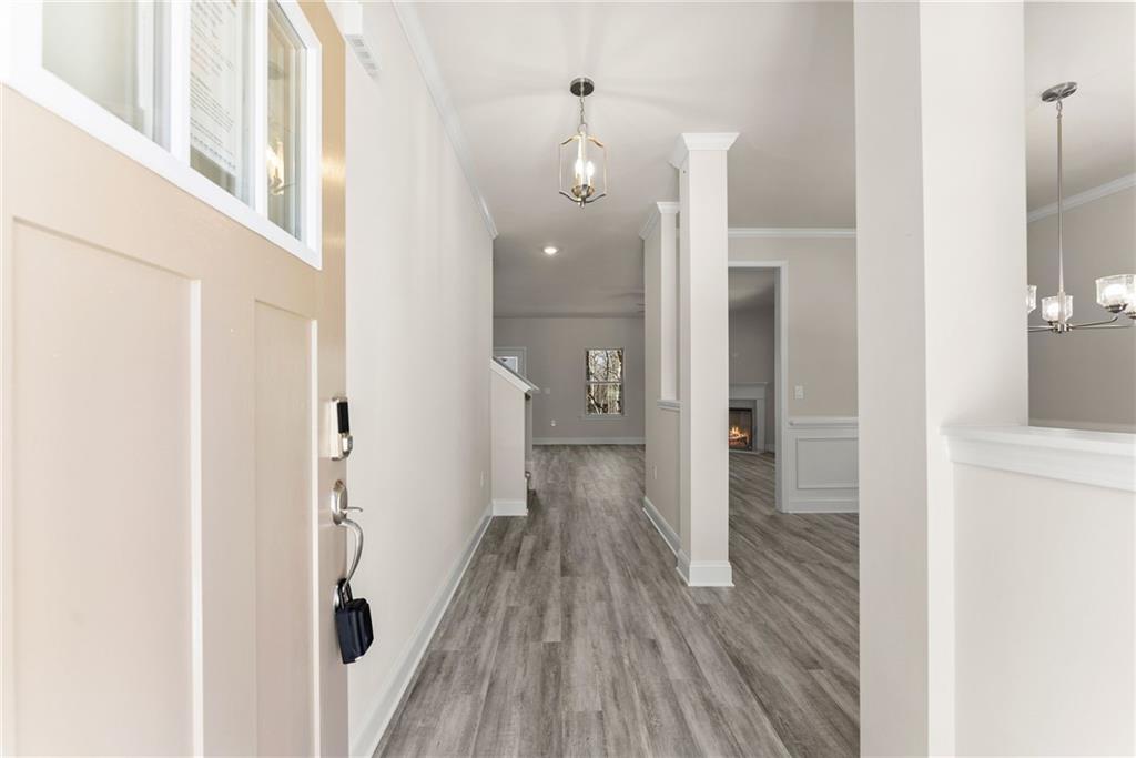 657 Forest Way Cornelia, GA 30531 - Photo 9 of 54 a view of a hallway with wooden floor