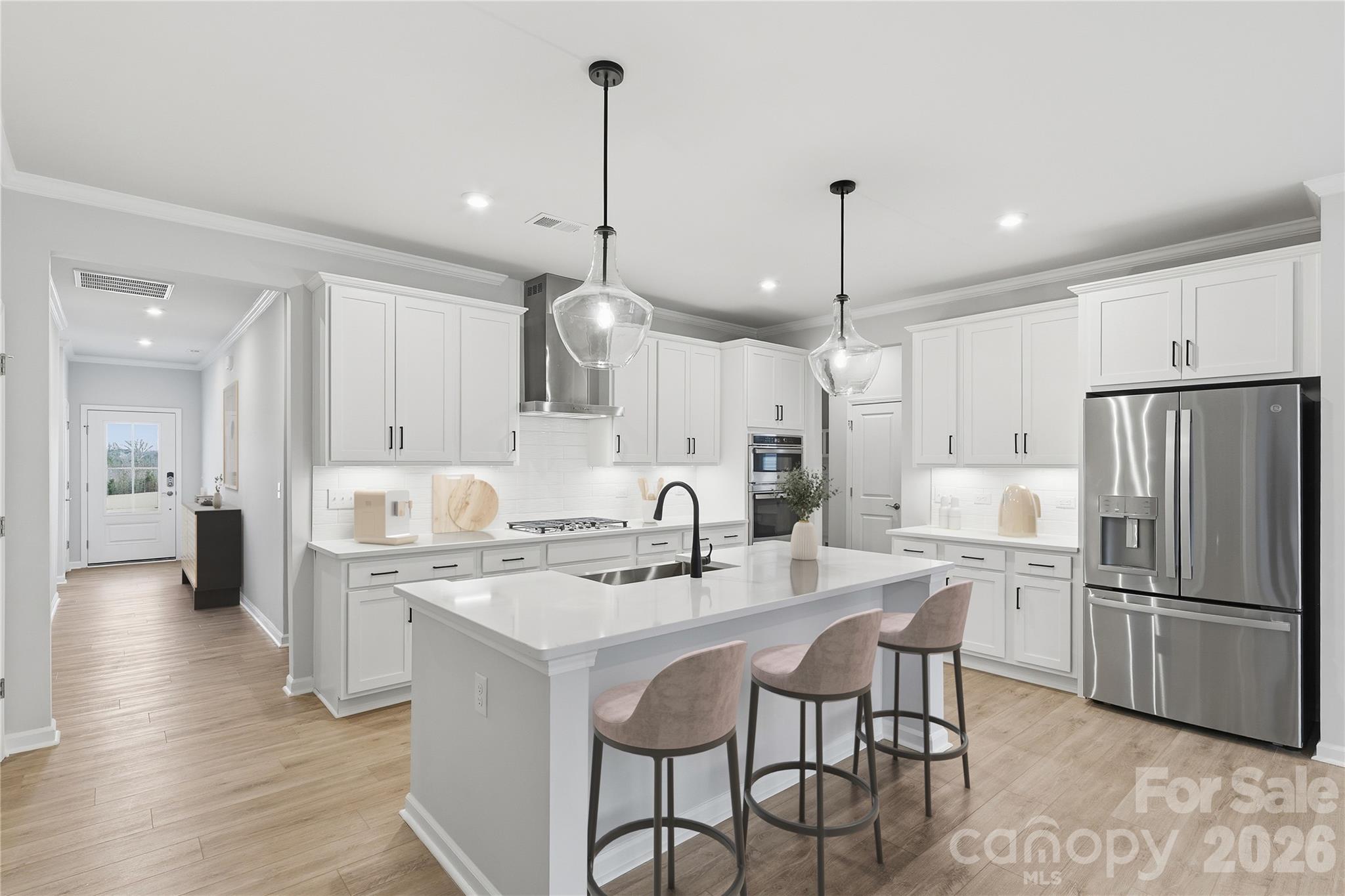 1028 Garfield Road Sherrills Ford, NC 28673 - Photo 11 of 37 a kitchen with kitchen island granite countertop a sink a center island and stainless steel appliances