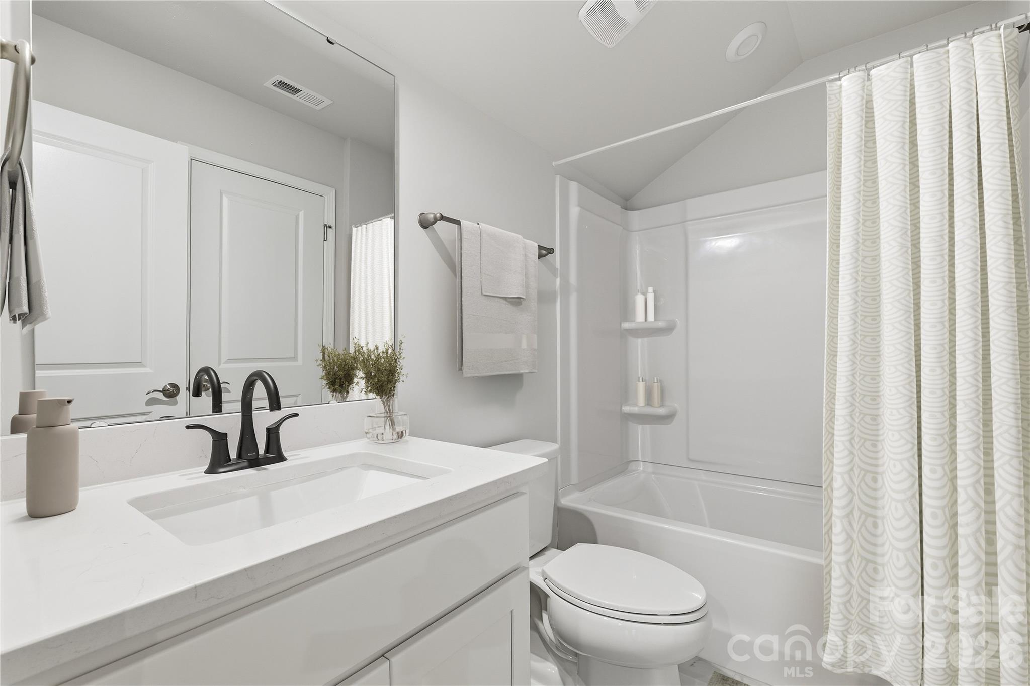 1028 Garfield Road Sherrills Ford, NC 28673 - Photo 14 of 37 a bathroom with a sink a toilet and shower