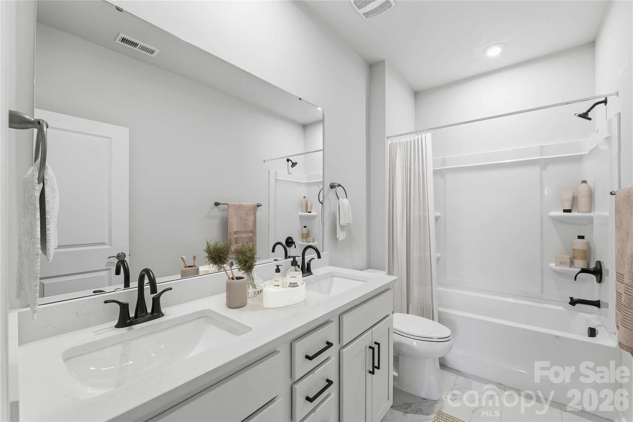 1028 Garfield Road Sherrills Ford, NC 28673 - Photo 16 of 37 a bathroom with a sink a toilet and shower