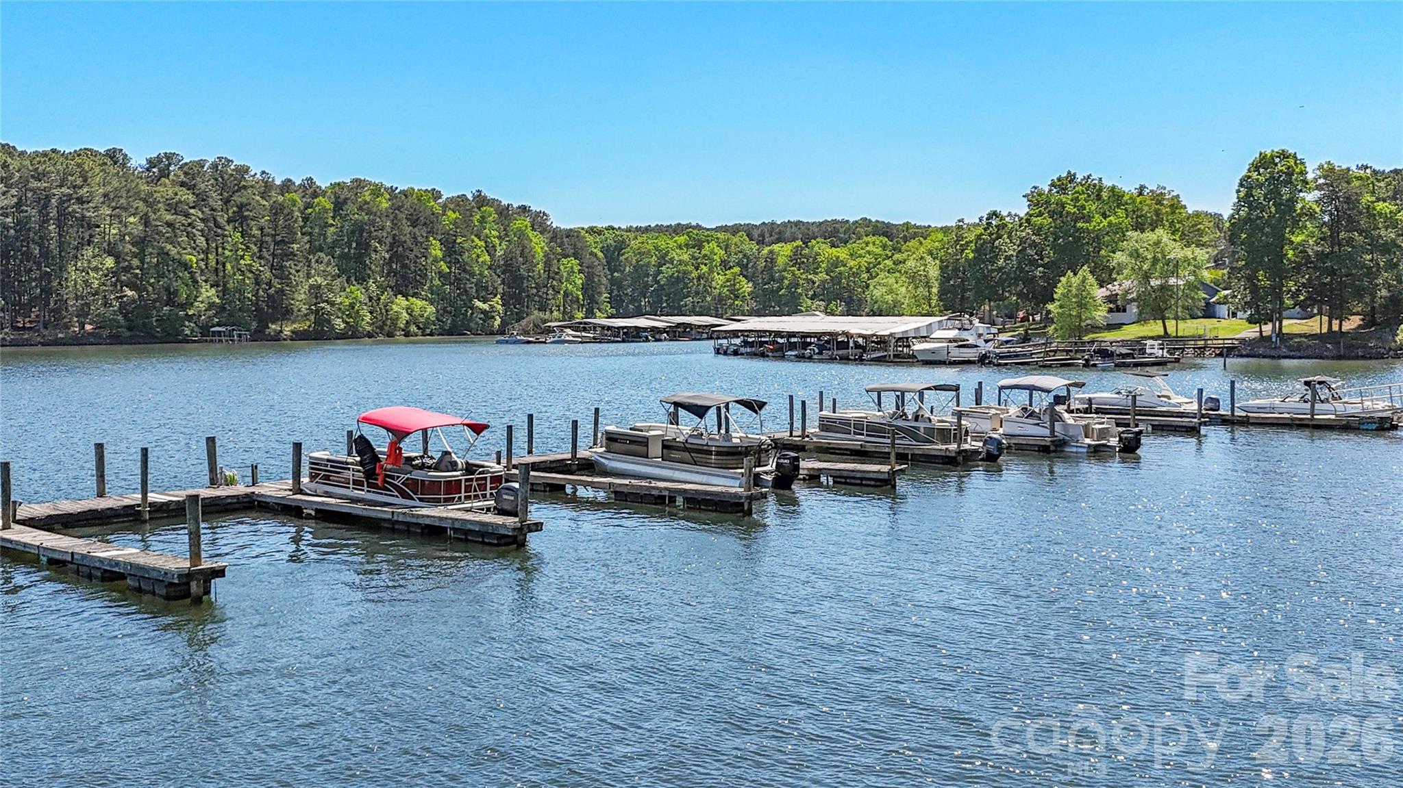 1028 Garfield Road Sherrills Ford, NC 28673 - Photo 4 of 37 a view of a lake with boats and trees in the background