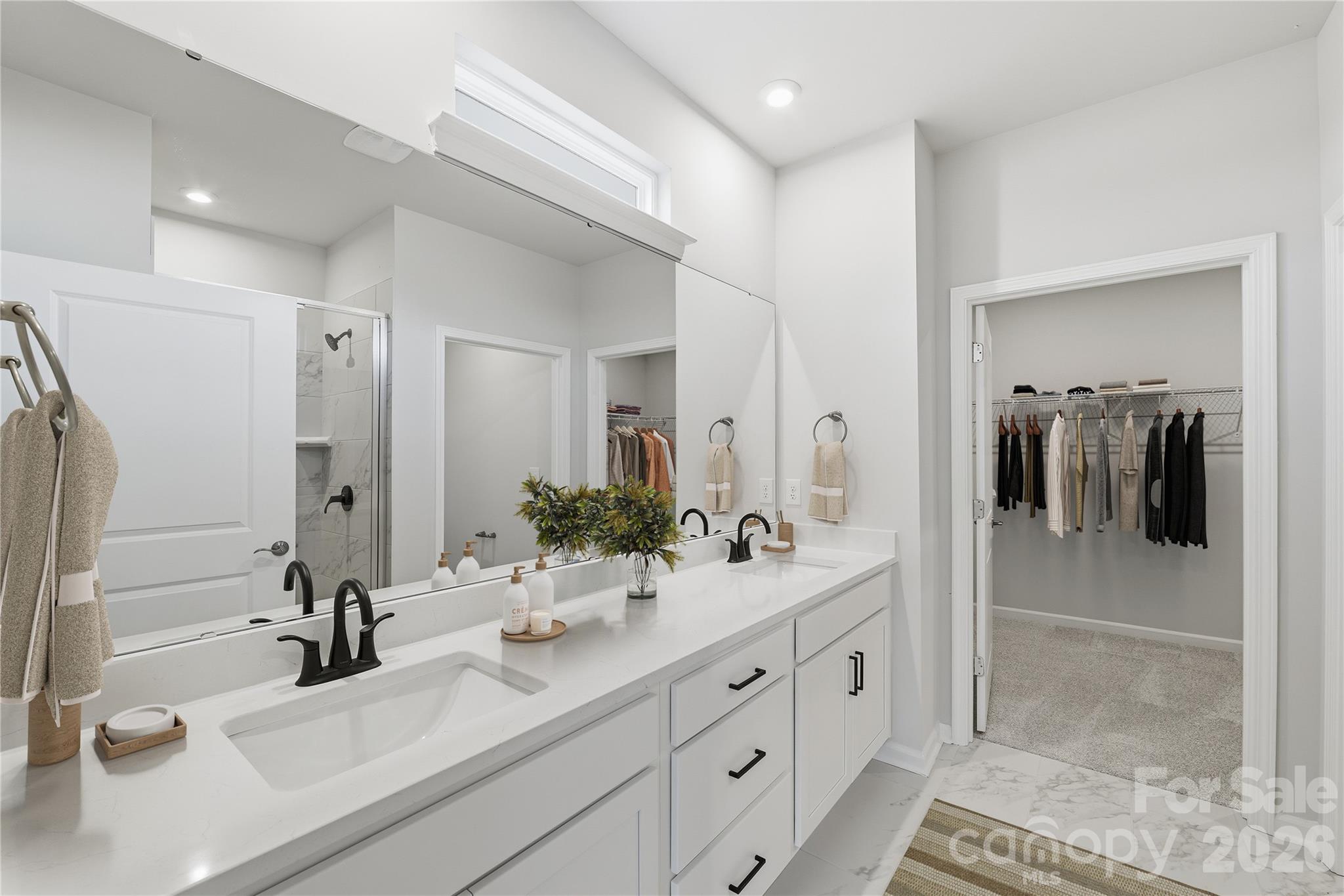 1028 Garfield Road Sherrills Ford, NC 28673 - Photo 5 of 37 a bathroom with a double vanity sink and mirror