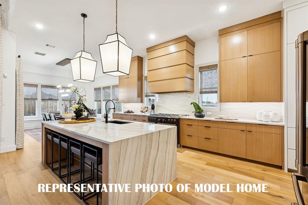 2460 Harpole Road Prosper, TX 75078 - Photo 8 of 9 All of our new floor plans in Prosper Ridge offer dream kitchens where every chef in the family can create culinary delights! REPRESENTATIVE PHOTO OF MODEL HOME