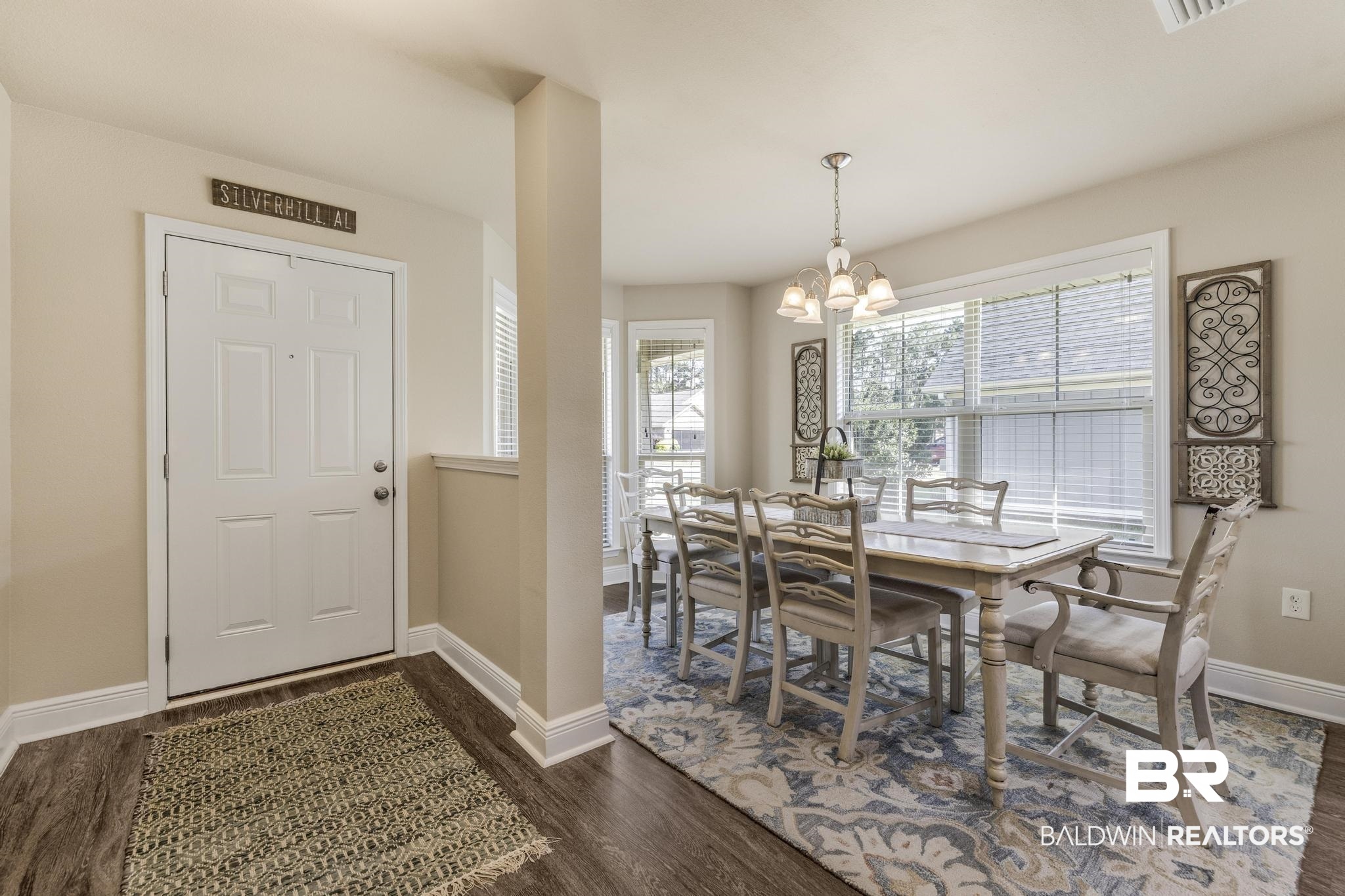 22043 Garland Loop Silverhill, AL 36576 - Photo 7 of 41 Dining space with hanging lights and dark wood-style flooring