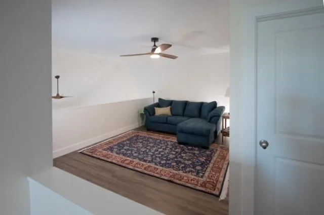 a living room with furniture and a rug