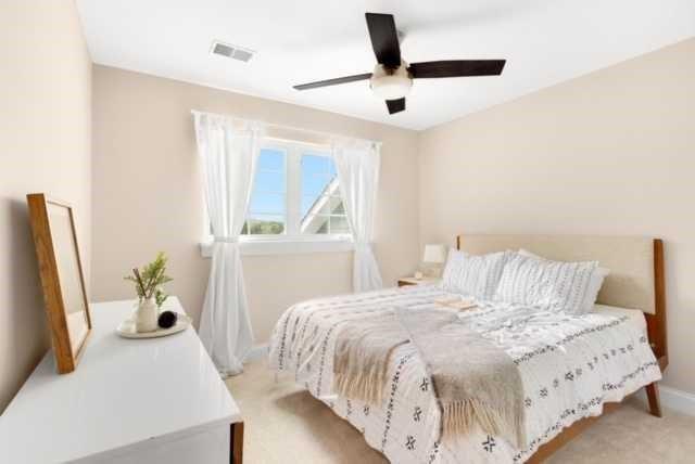 27 Pinehurst Place, Unit 27 Beaver, PA 15009 - Photo 13 of 19 a bedroom with a bed and a large window