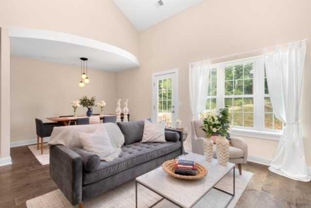 27 Pinehurst Place, Unit 27 Beaver, PA 15009 - Photo 5 of 19 a living room with furniture and a large window