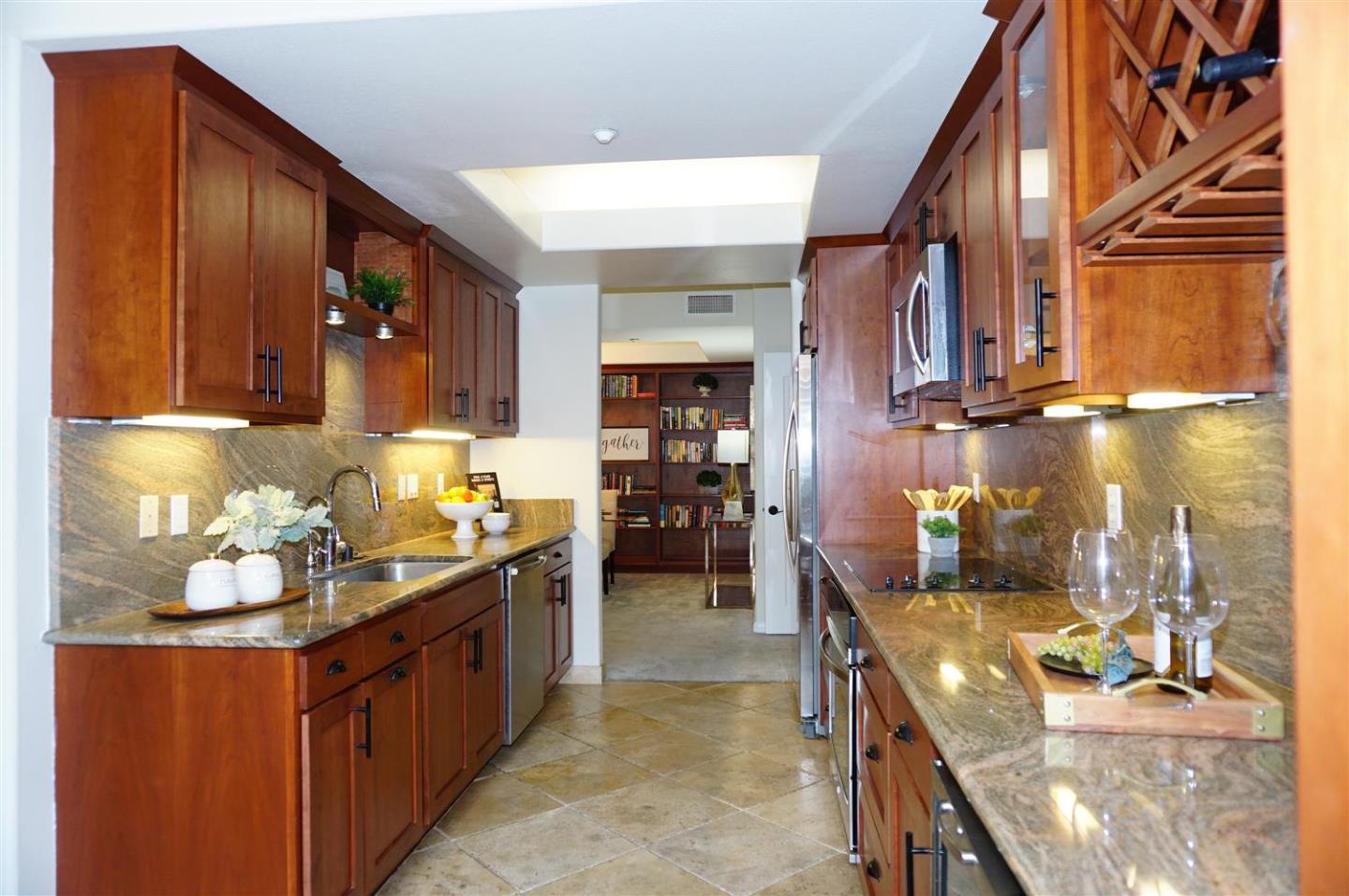 a kitchen with sink cabinets and stove