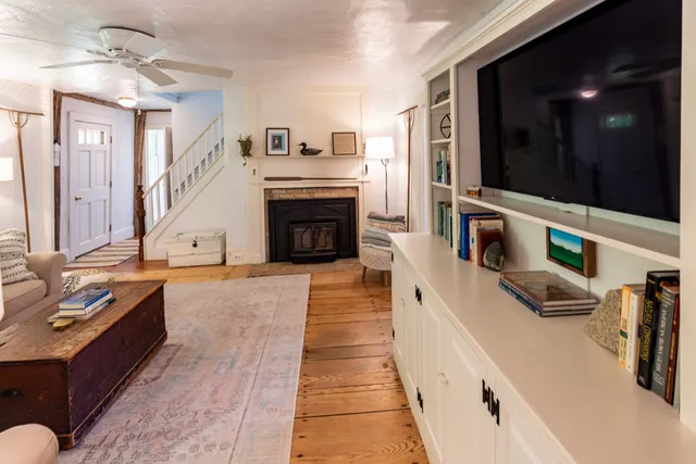 a bathroom with a granite countertop toilet a sink and a mirror