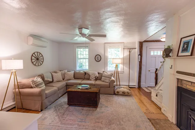 a backyard of a house with outdoor seating