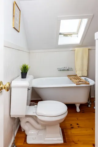 a view of a house with sitting area and garden