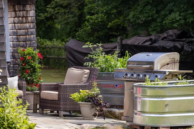 a kitchen with a stove and a white cabinets