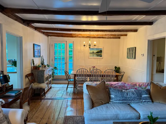 a view of a dining room with furniture and window
