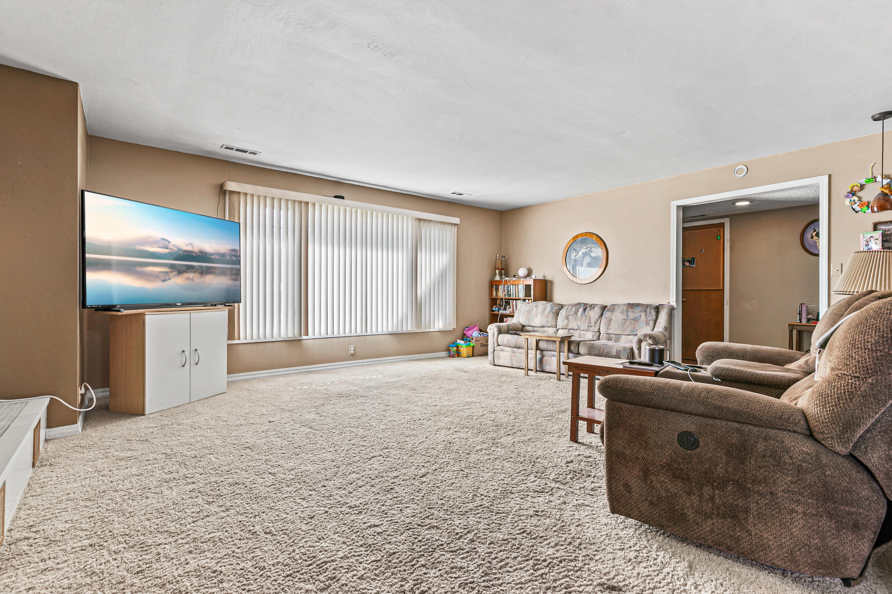 3200 Hanley Road Central Point, OR 97502 - Photo 7 of 25 a living room with furniture a large window and flat screen tv