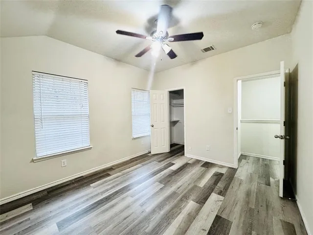 a bathroom with a double vanity sink and mirror