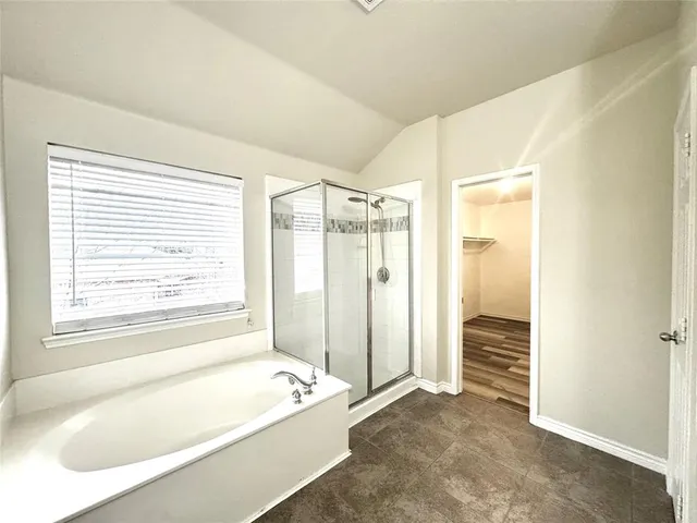 a spacious bathroom with double sink and a mirror