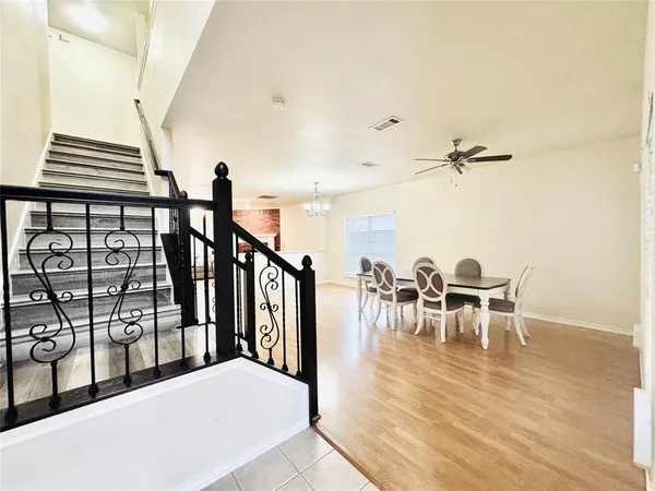 a view of a dining room with furniture and a table